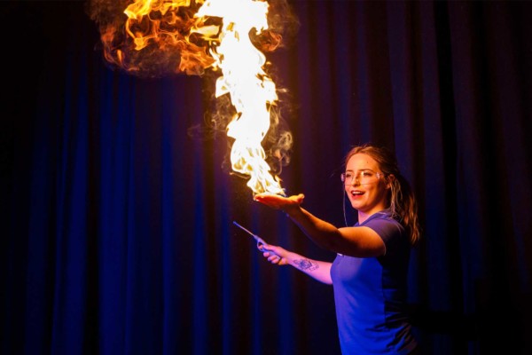 demonstrator, Mars, using fire in live science show