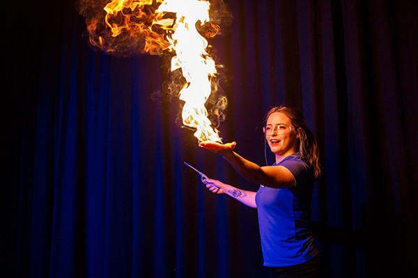demonstrator, Mars, using fire in live science show