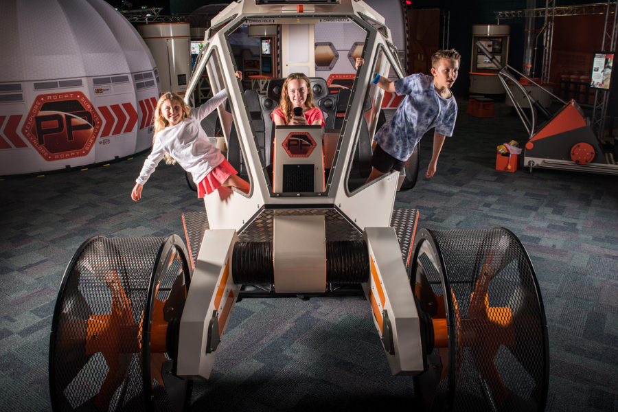 Children exploring the Destination Mars rover exhibit